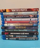 Stack of 11 Blu-ray movie cases showing titles on the spines for identification.