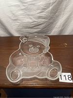 Front view of clear crystal teddy bear serving platter with face and bow tie engraving.