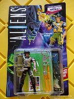 Front view of the Aliens Space Marine Cpl Hicks action figure in original sealed packaging showing figure and accessories.