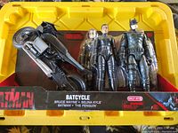 Photo of Batman and Friends action figure set with Batcycle in original packaging. Set includes Bruce Wayne, Selina Kyle, Batman, and The Penguin figures.