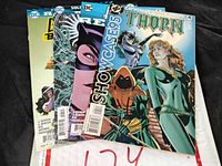 Front view of five DC comic books including Thorn #4, Showcase 95, and Birds of Prey series comics.