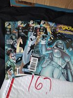 Four Ghost Batgirl comic books, issues #1, #2, #3, and #4, fanned out showing cover art and spines.
