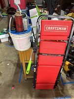 Full view of Craftsman red creeper showing padded surface and handle
