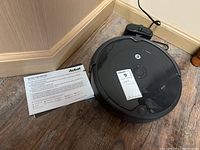 Robot vacuum, charging dock, and manual arranged on floor