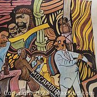 Close-up of colorful vintage poster art with figures and Mozambique text