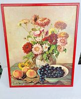 First image showing vintage still life art print with flowers, peaches and grapes, red frame