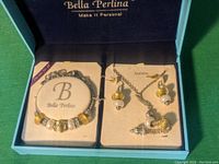 Bella Perlina bracelet and necklace set in original box with yellow and silver beads and charms.