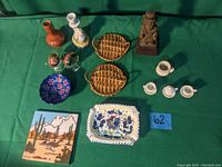 Top view of entire lot showing all items arranged on a green cloth background for reference and condition assessment