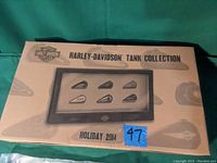 Photo of boxed Harley Davidson Tank Collection shadow box, labeled Holiday 2014 with six miniature tanks.
