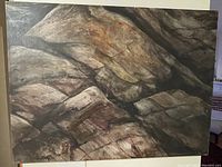 Front view of acrylic painting depicting dark split rock formation