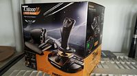 Box front showing product image and branding of Thrustmaster T.16000M FCS HOTAS flight control system.