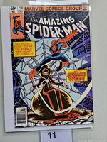 Front cover of Amazing Spider-Man #210 comic book showing Spider-Man and Madame Web character.