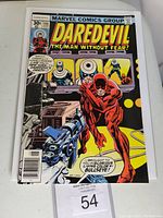 Front cover of Daredevil #146 comic book showing Daredevil in red costume confronting Bullseye.