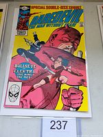Front cover of Daredevil #181 comic book showing Bullseye kills Elektra storyline with bright yellow background and bold colors.