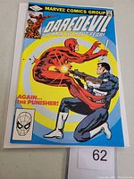 Front cover of Daredevil #183 comic book featuring Punisher and Daredevil with action shot, bright blue background.