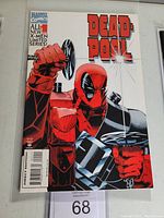 Front cover of Deadpool #1 comic book showing Deadpool with swords and title in bold red letters.