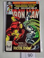 Front cover of Iron Man #150 comic book showing Iron Man fighting Doctor Doom with the comic title and anniversary special text.