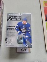 Front view of sealed blaster box of 2021-22 O-Pee-Chee Platinum hockey cards showing player image and product details.