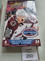 Sealed unopened hobby box of 2020-21 Upper Deck Extended Series hockey cards showing front with player image and branding.