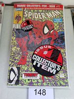 Front view of Spider-Man #1 comic book with collector's item circular stickers on the cover, bagged.
