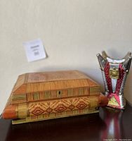 Side view of the wooden trinket box and Persian incense burner showing detailed craftsmanship