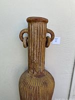 Close-up of fluted neck and double loop handles