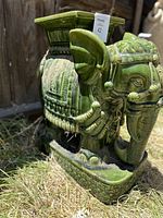 Right-side view of the elephant stand showing body decoration and base pattern.