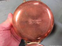 Bottom view showing Cu Artigiana brand mark and 'HandMade in Italy' engraving on copper surface