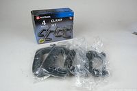 Four metal clamps new in box wrapped in plastic with AllTrade packaging visible.