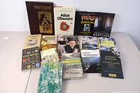 Full view of all 11 books arranged on a table, showing a variety of titles related to Maryland history and nature.
