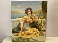 Full view of the unframed oil painting showing a seated woman in classical dress, outdoor waterside setting