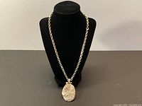 Full view of the chain necklace displayed on a bust