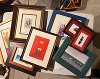 Overview of all 8 framed artworks showing variety of styles and sizes.