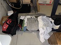 Complete set of fencing gear and accessories including bag, foils, uniform, gloves, and muscle roller stick