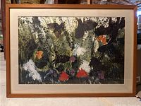 Full frontal view of the framed artwork showing abstract nature-inspired design with various colors and textures.