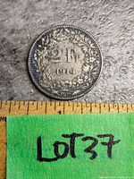 Front side of 1914 French 2 Franc silver coin showing '2 Fr. 1914' surrounded by floral wreath and coin edges.