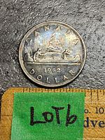 Photo of the 1962 Canada Silver Voyageur Dollar Coin, showing full front face with the Voyageur design and mint year.