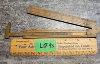 Photo showing the full length of the folding boxwood ruler with brass hinge and measurement markings.