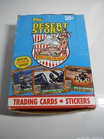 Front view of unopened vintage Topps Desert Storm trading cards and stickers box showing branding and price of 50 cents.