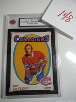 Full view of the card in KSA plastic slab showing front of card and grading label