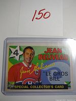 Front image of Jean Beliveau hockey card in protective sleeve, showing number 4 and nickname 'Le Gros Bill'.