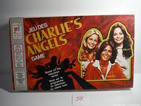 Front view of the vintage Charlie's Angels board game box, showing the title and lead characters from the TV series Kris, Sabrina, and Kelly.