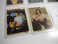 Close-up of two Star Trek trading cards from The Motion Picture series showing Spock and an alien character