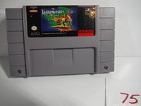 Front of the SNES cartridge showing 'The PageMaster' game label with artwork and Nintendo licensing information.