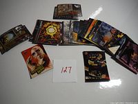 Spread of various collectible Universal Monsters trading cards showing diverse characters and scenes, some cards partially overlapped.