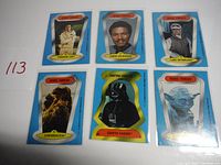 Photo showing all six Star Wars character stickers: Princess Leia, Lando Calrissian, Luke Skywalker, Chewbacca, Darth Vader, and Yoda.