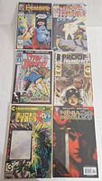 Photo of six comic books including Excalibur, Marvel Fanfare, Star Brand, Proof Enangered, CyberRad, Ninja Scroll.