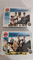 Photo of two Airfix model boxes: Waterloo French Grenadiers of the Imperial Guard and French Artillery with scale 1/72 and piece count.
