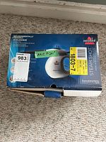 Box of the Bissell SteamShot portable steamer with visible branding and eco-friendly claims.