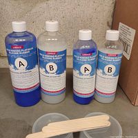 Four bottles in total, two pairs of Part A and Part B silicone rubber liquids from the brand LARDICO, with clear labeling and blue and white packaging.